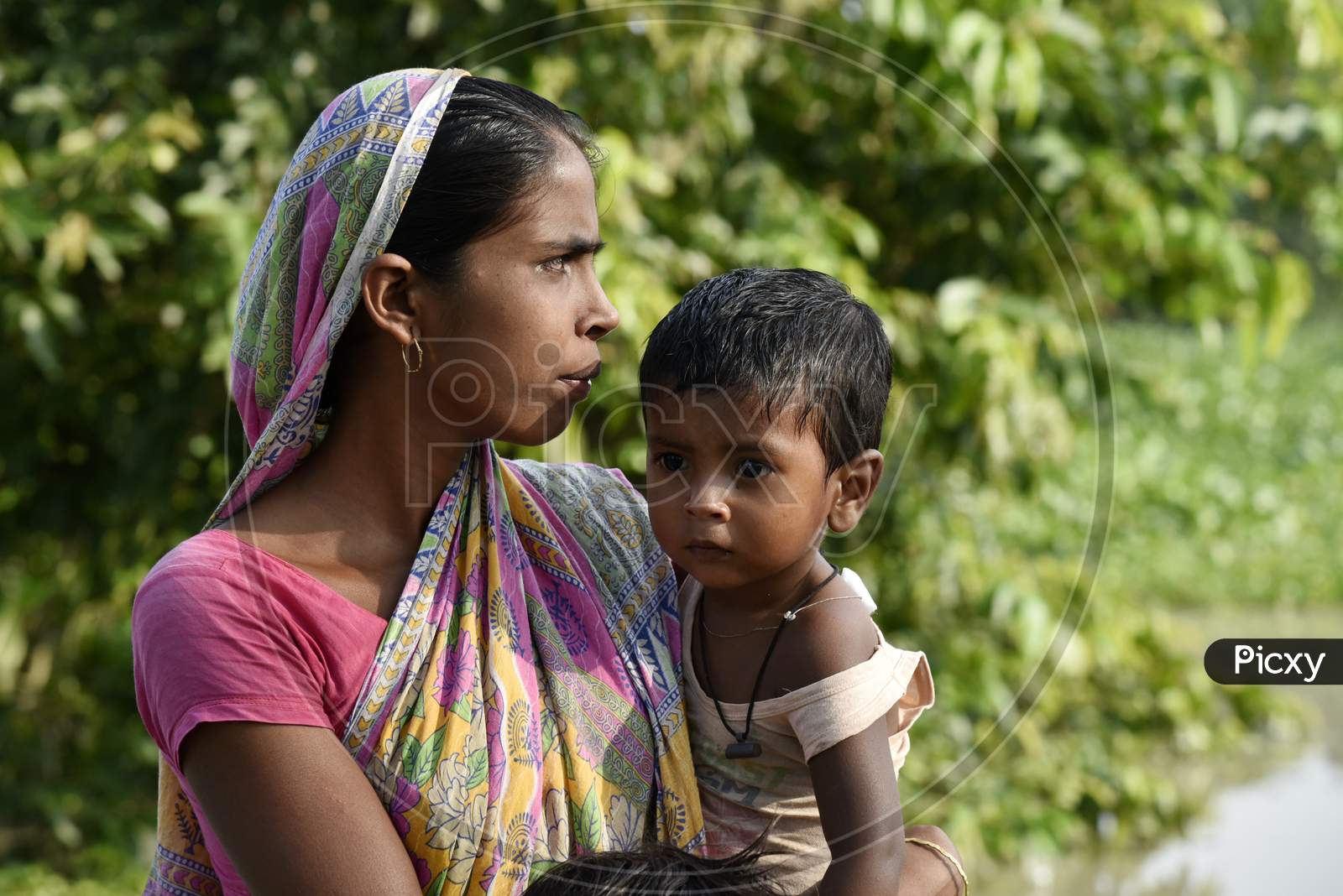 A Mother With Her Child In Assam Villages