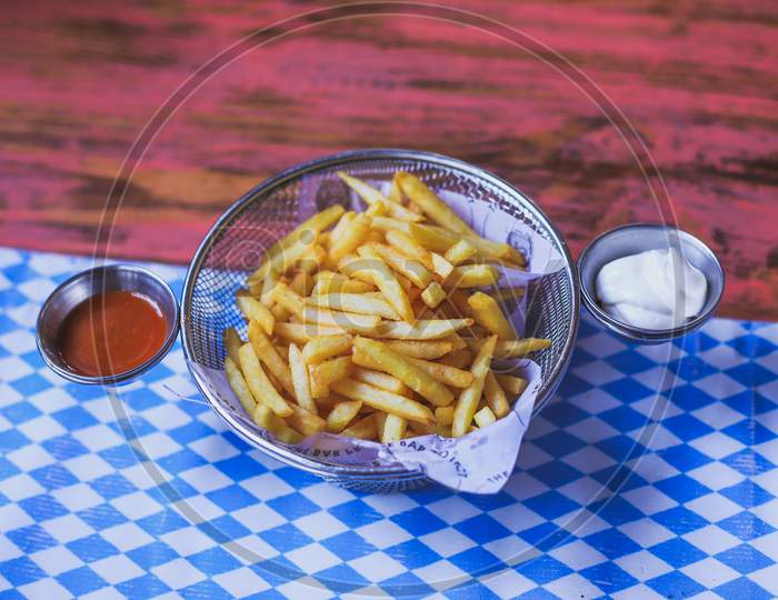 French Fries With Mayonese and Tomato Sauce