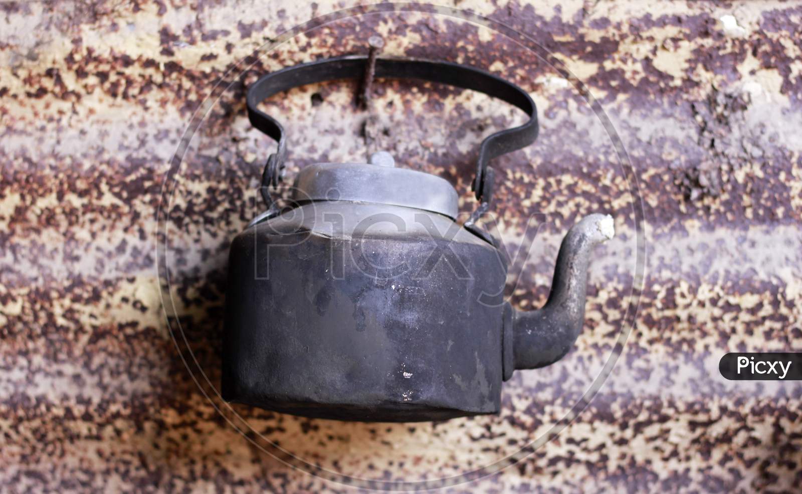Tea Kettle Tagged To  Wall