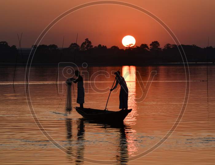 Indian Fishermen Fishing In Beki River During Sunset, At Sarbhog In Barpeta District Of Assam