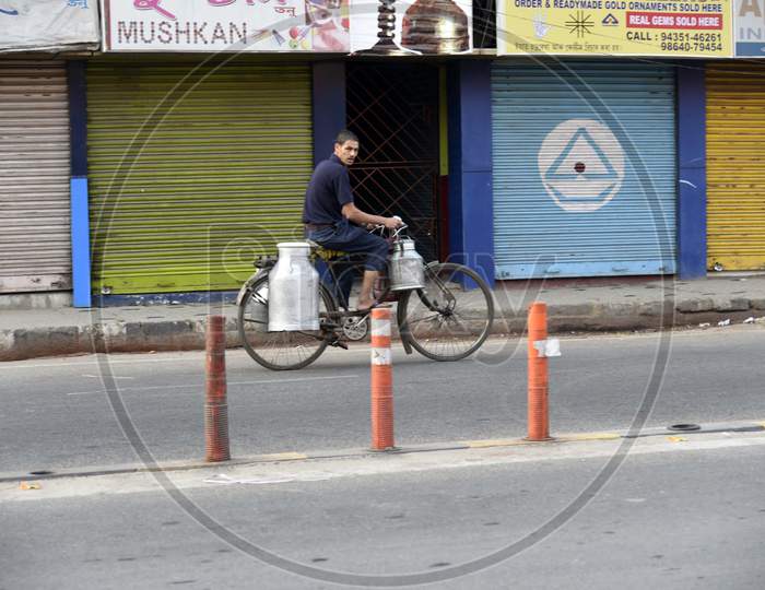 A Milk Vendor Cycling In Front Of Closed Shops, During A Strike Called By All Assam Students’ Union (Aasu) And The North East Students’ Organisation (Neso) In Protest Against The Citizenship Amendment Bill, At Fancy Bazaar In Guwahati