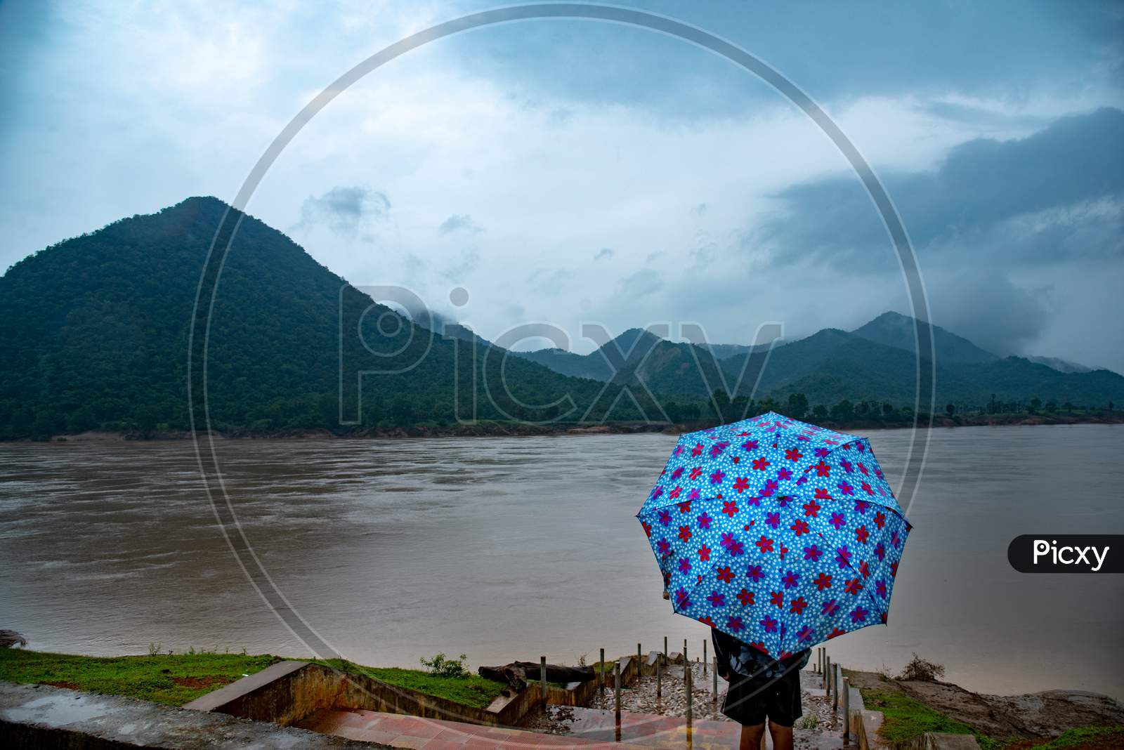 A Man Standing At a Bank Of River Godavari River