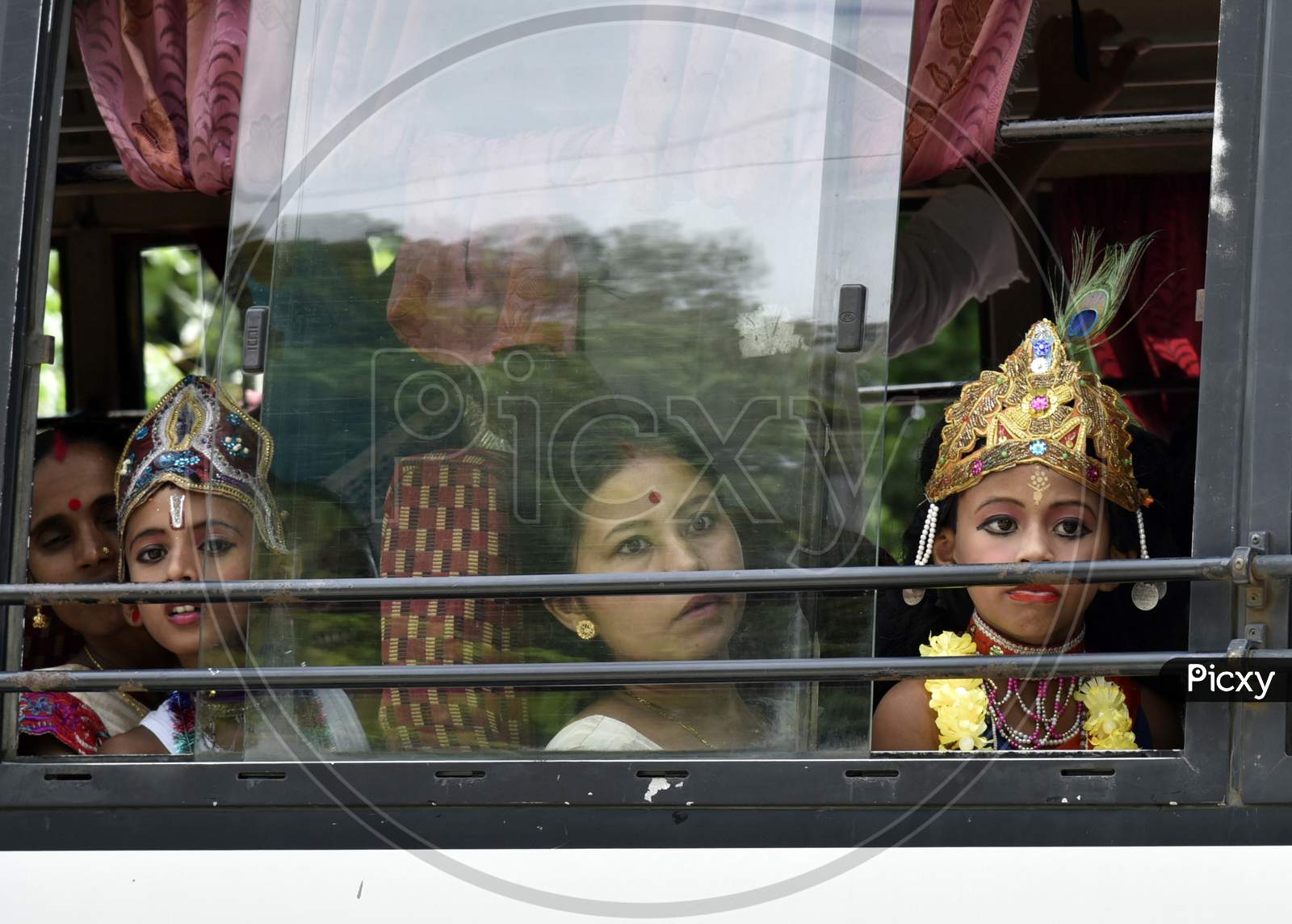 Little Children Dressed Up As Lord Krishna In A Bus During The Janmashtami Festival In Morigaon, Assam, India