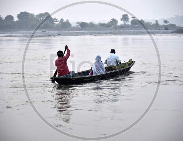 . People Crossing Manas River To Home After Work, In Baksa District Of Assam
