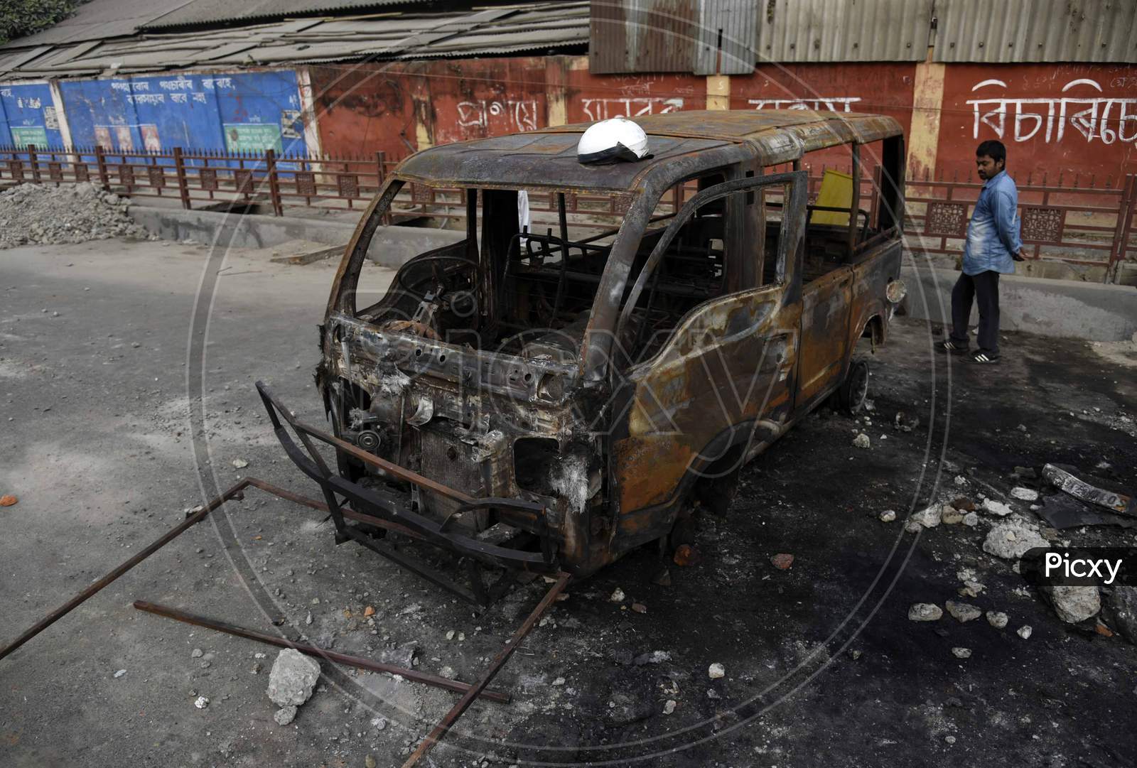 A Charred Vehicle Which Was Reportedly Set On Fire By The Protestors During A Demonstration Against The Citizenship Amendment Bill, In Guwahati