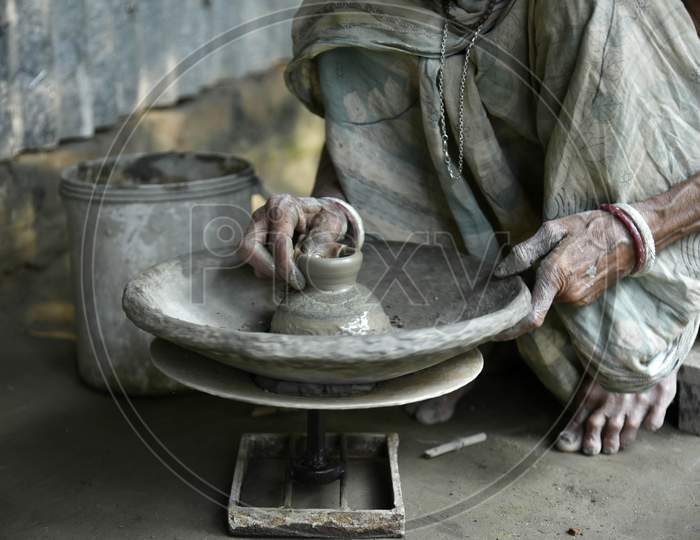 Woman Potter Prepares A Clay Lamps In Her Residence Ahead Of Diwali Festival, In The Outskirt Of Guwahati, In Assam