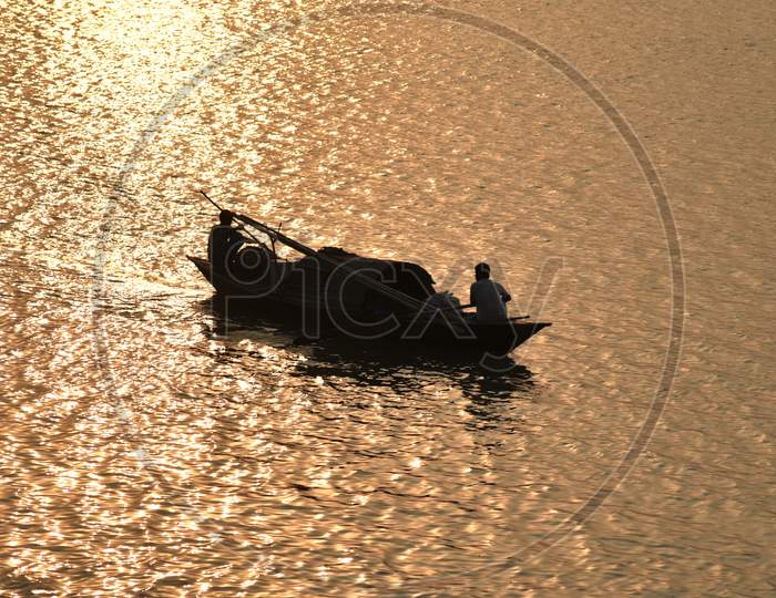 Silhouette of A Boat Carrying Sand From Bramhaputra River Bed  in Guwahati, Assam