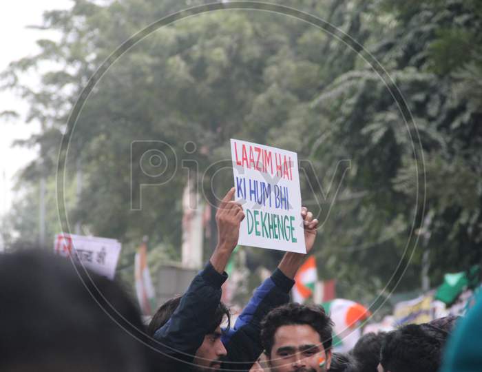 Indian People Protest Against CAB, CAA And NRC  By  Holding Placards in Delhi