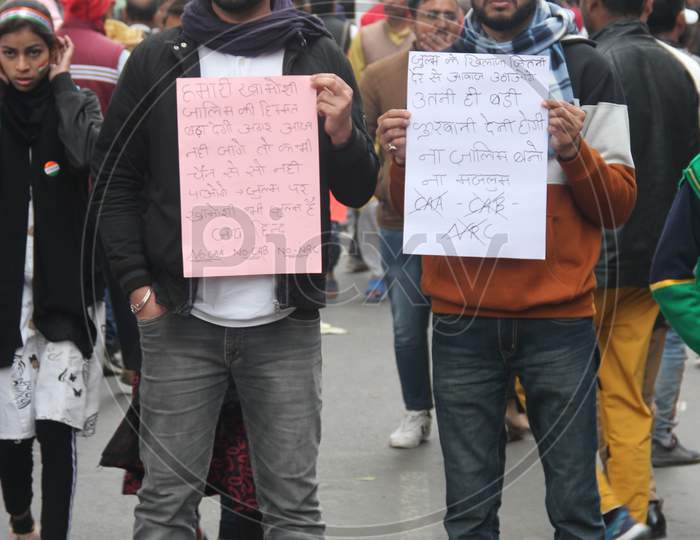 Indian People Protest Against CAB, CAA And NRC  By  Holding Placards in Delhi