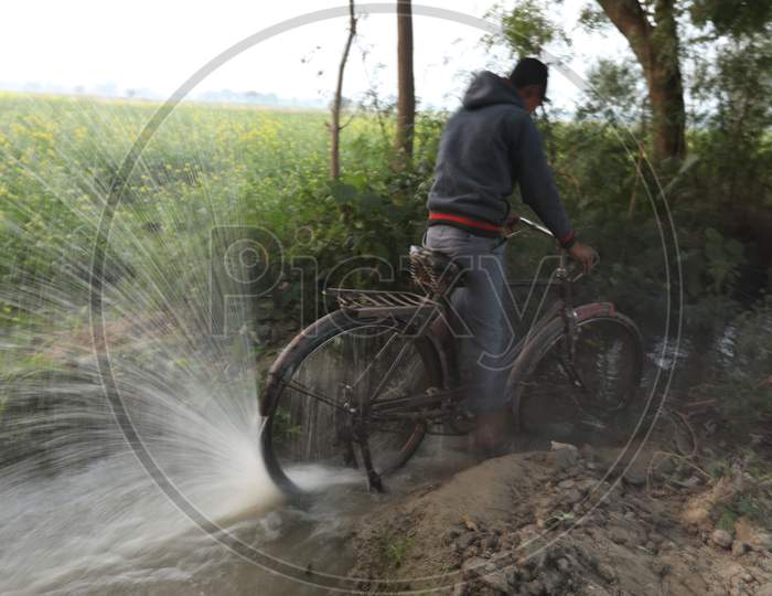 Water Splash With Bicycle Back Tyre in an Water  Pond