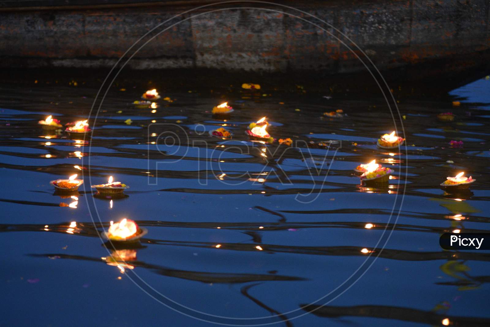 Devotees Leaving Dias in River Ganga In Varanasi