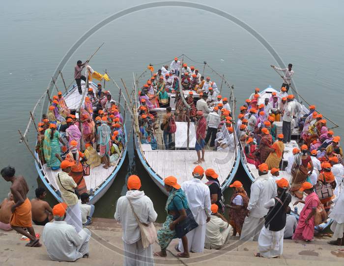 devotees Taking Boat Rides in Ganga River in Varanasi
