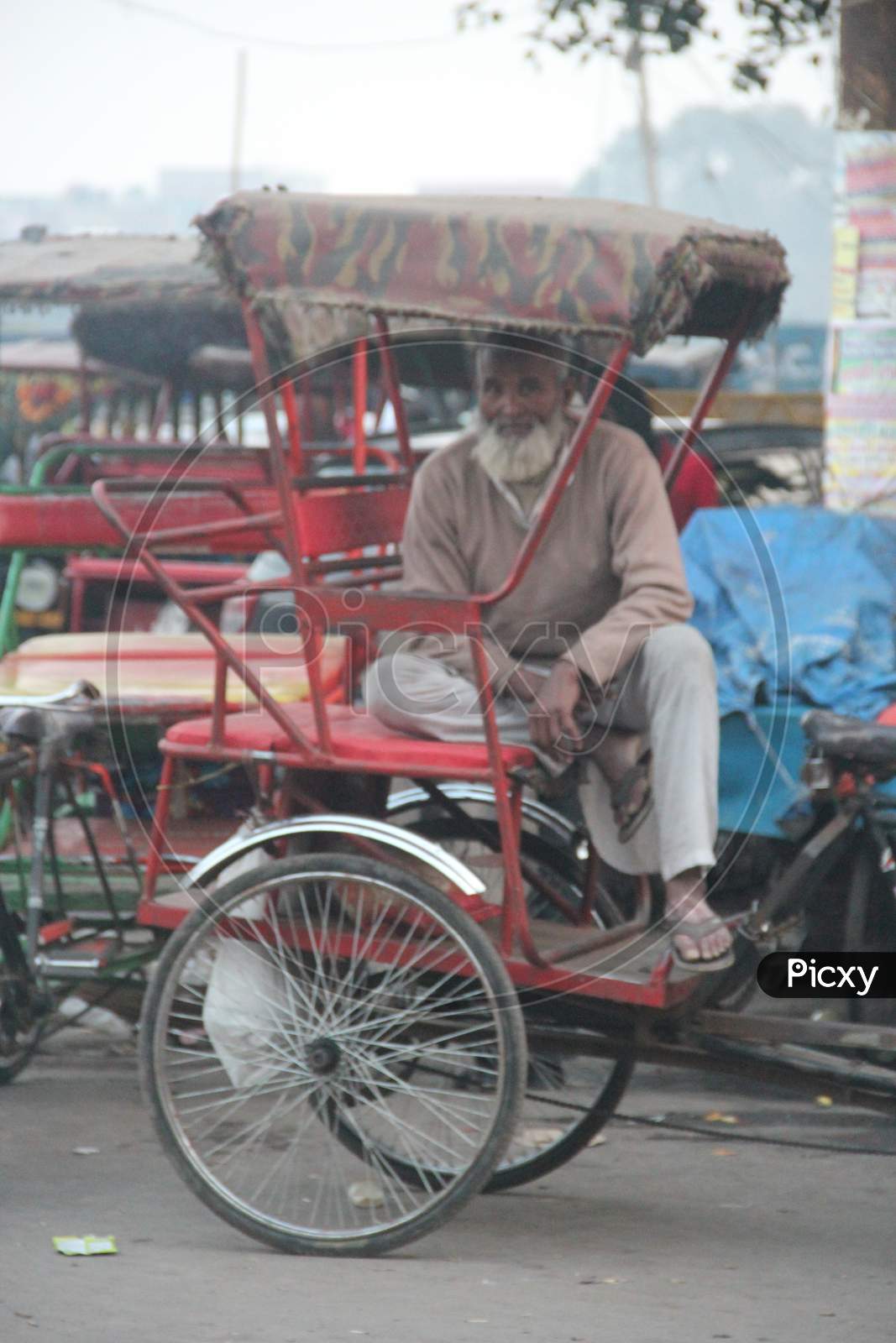 Rickshaw Puller On The Streets Of Delhi