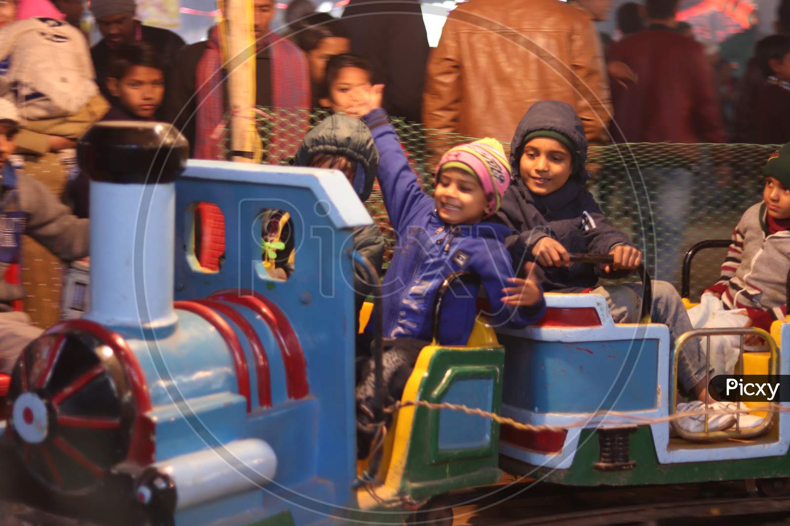 Children Enjoying Amusement Rides in an Fair