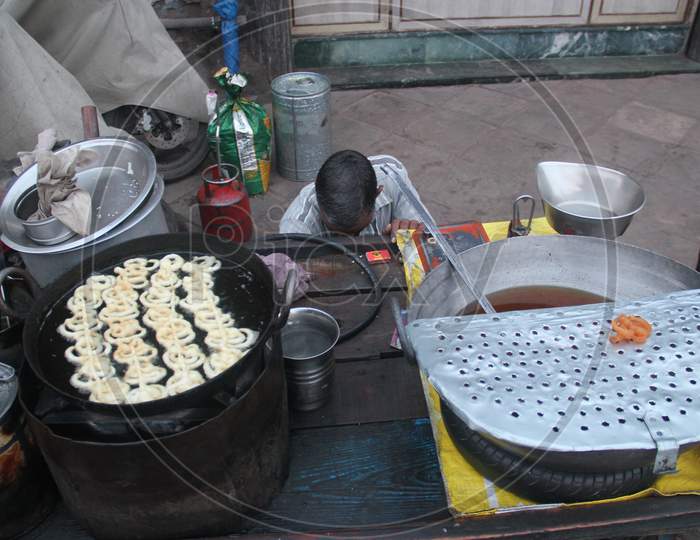 Indian Street Food Vendor Making Jilebi At a Stall