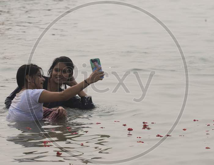 Girls Takes Selfi After Takes Holy Dip In The Sangam, Confluence Of Three Rivers, The Ganga, The Yamuna And Mythical Saraswati During Smoke Morning In Prayagraj