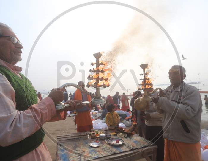 Hindu Devotees Performing  Aarthii or Pooja To Holy River Ganga In Prayagraj