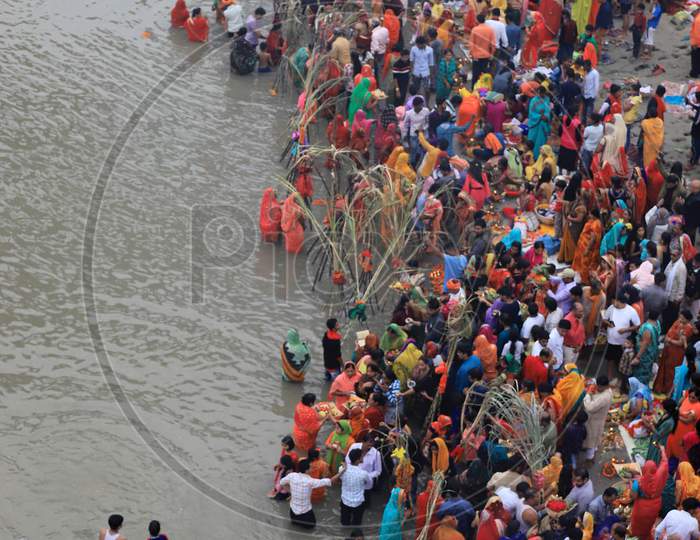 Hindu Women Worship The Sun God In The Waters Of The Ganga River During The Religious Festival Of Chhath Puja In Prayagraj