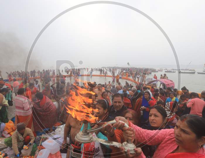 Devotees Performing Pooja Aarthi To River Ganaga At Prayagraj