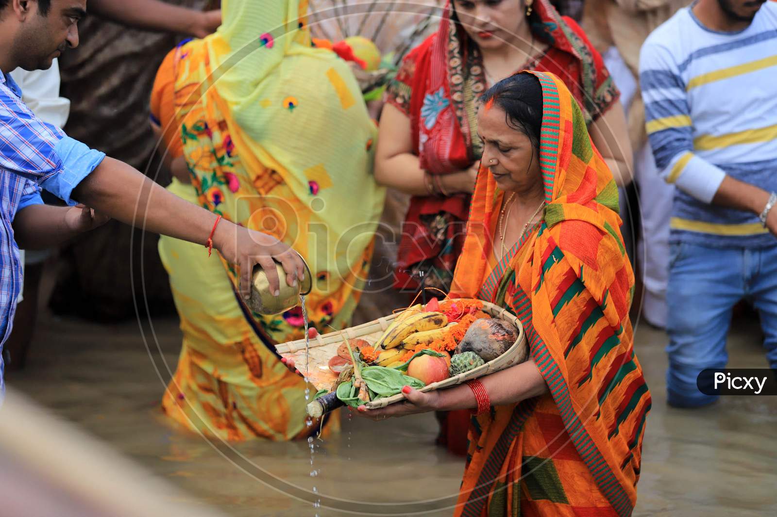 Hindu Women Devotees Offering Chhath Puja During Chhath Festival On The River Bank Of Yamuna In Prayagraj