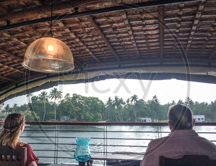 Tourists Enjoying Boat House Rides on Kerala Backwaters