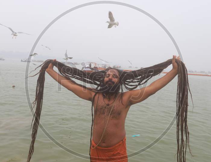 Indian Sadhu Or Baba Taking Holy Bath In River Ganga In Prayagraj