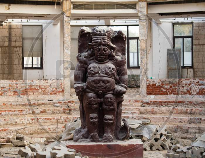 Some construction work and a statue at Delhi Public Library at Qila Rai Pithora