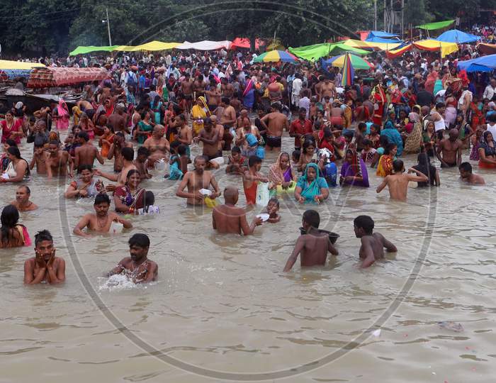 Hindu Devotees Takes Holy Dip In The Ganga River On The Occasion Of Nine Days Navratri Festival In Prayagraj,