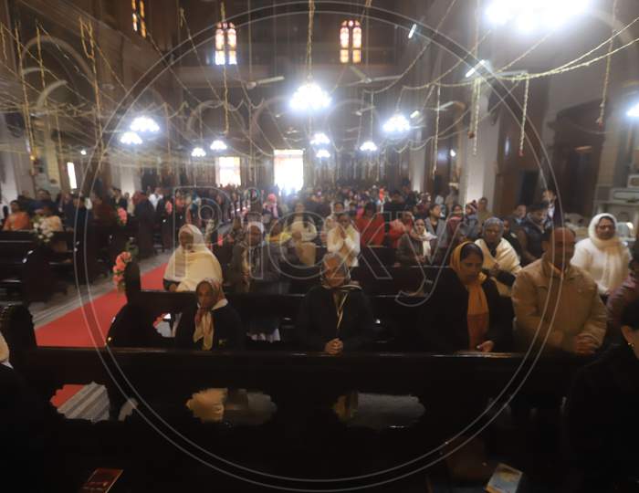 Christian Devotees Offering Prayers In a Church