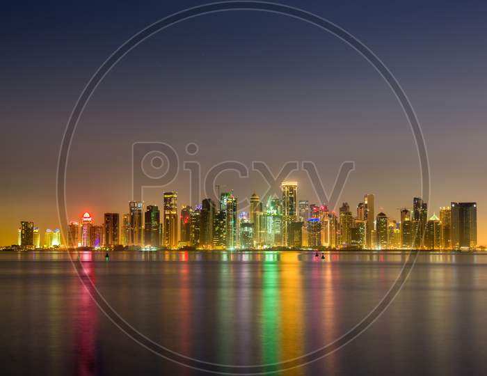 Skyline Of Doha At Night. The Capital Of Qatar