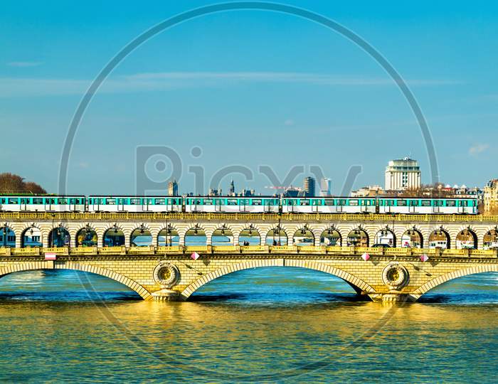 Metro Train On The Pont De Bercy, A Bridge Over The Seine In Paris, France