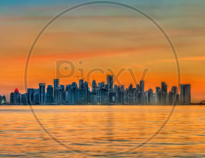 Skyline Of Doha At Sunset. The Capital Of Qatar