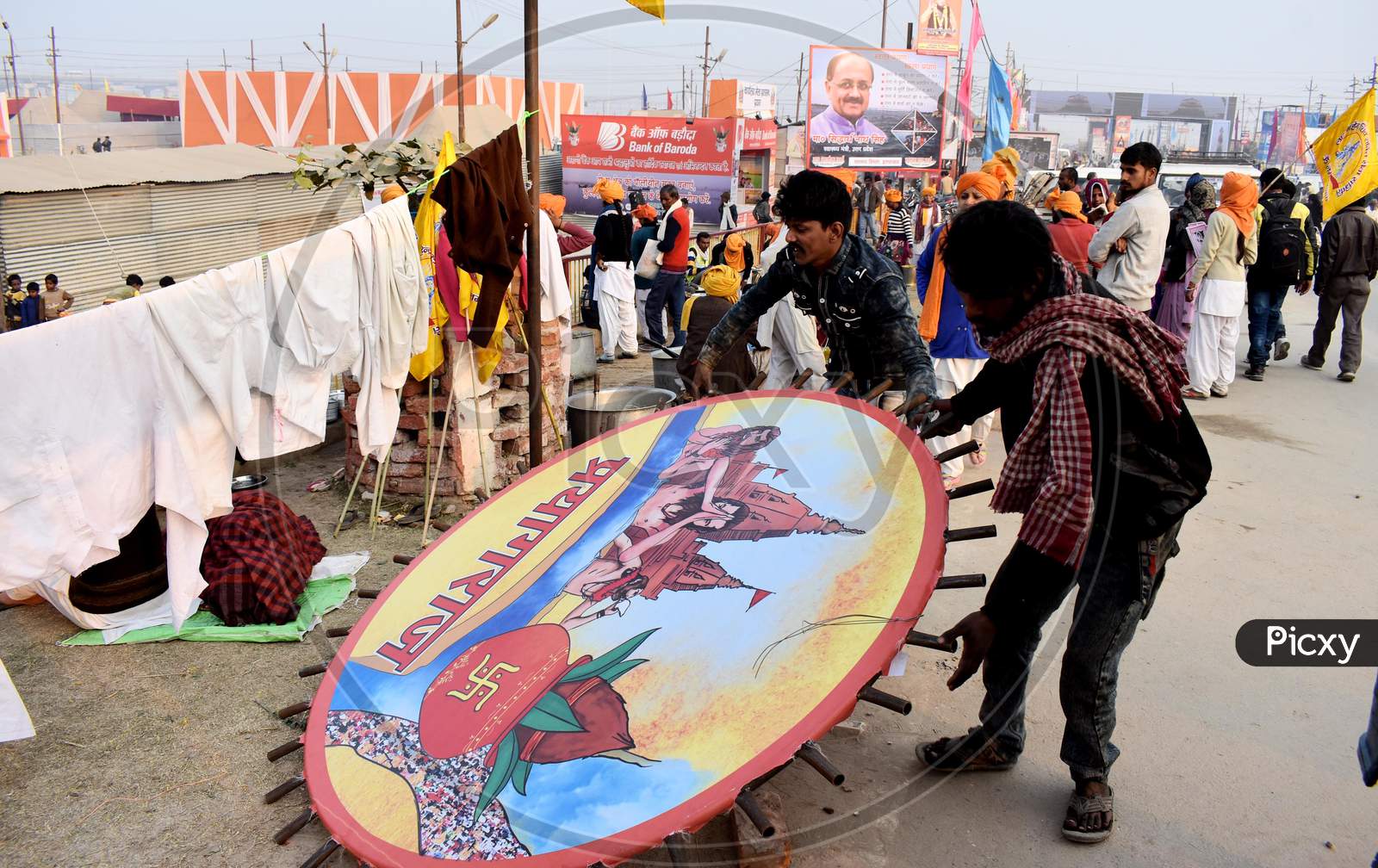 Volunteers Arranging Posters At Kumbh Mela