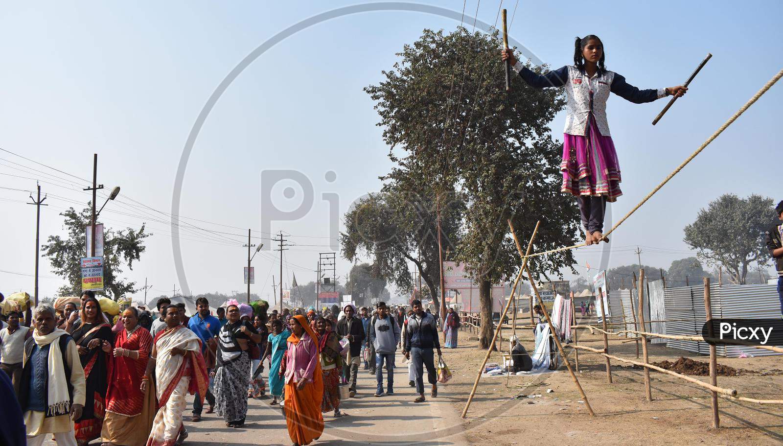 A Girl Walking on Thread At A Road Show Or Act