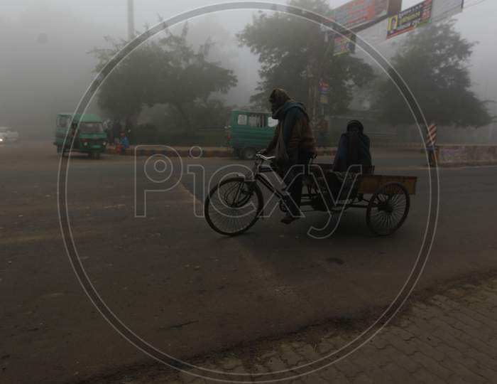 People in Foggy Roads in Winter Mornings