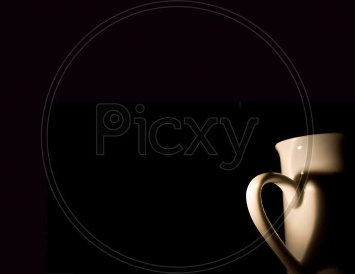White Coffee Cup With Shadow From Handle In Heart Form Black Background On International Coffee Day