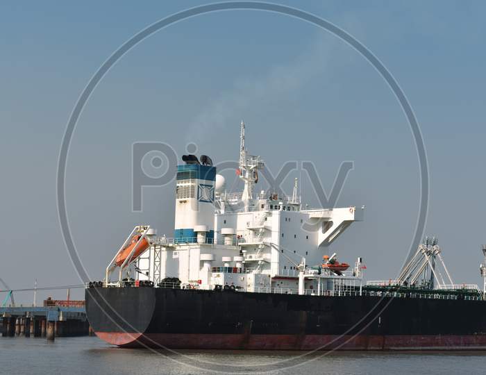 Merchant Ship Waiting For Departure From Its Port