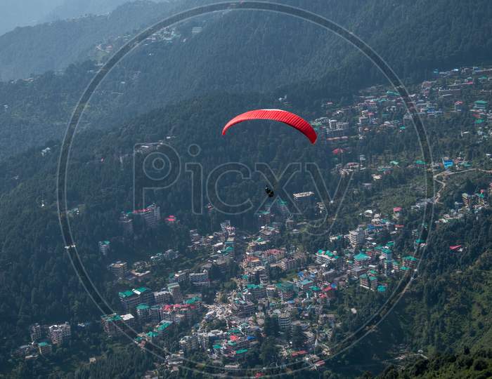 Paraglider In Mountains