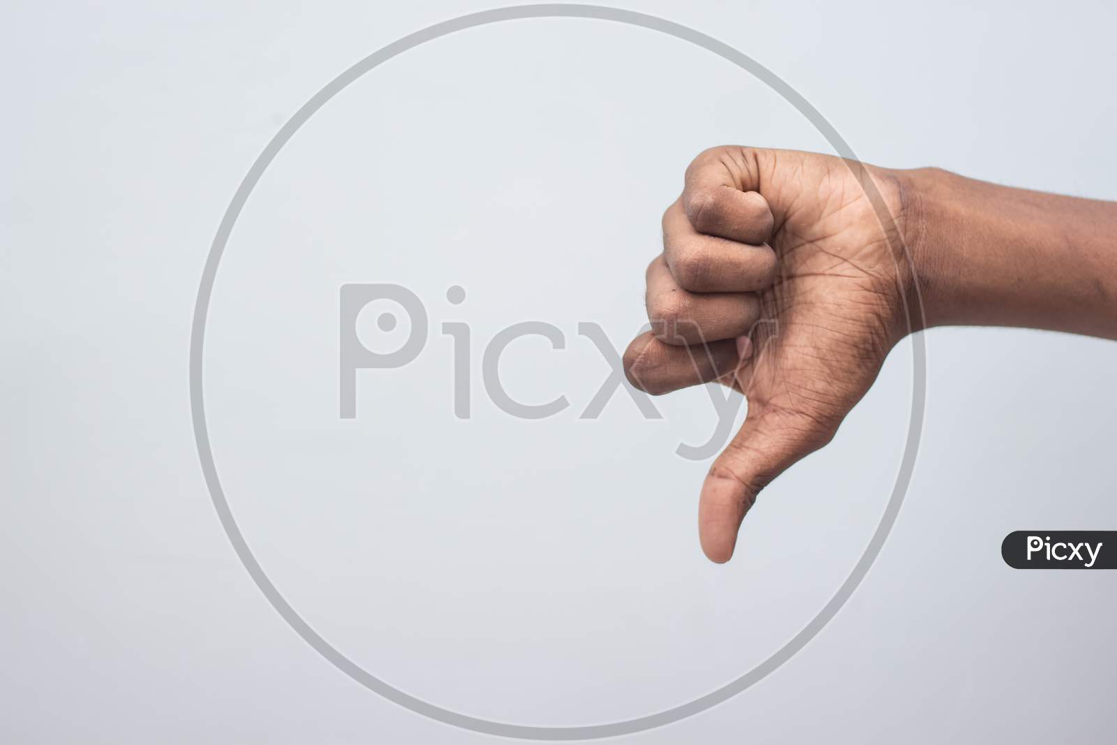Unlike, Dislike, Failure Gestures Concept - Male Hand Showing Dislike Thumb Down Sign Isolated On White Background. Hand Symbol Sign Language.