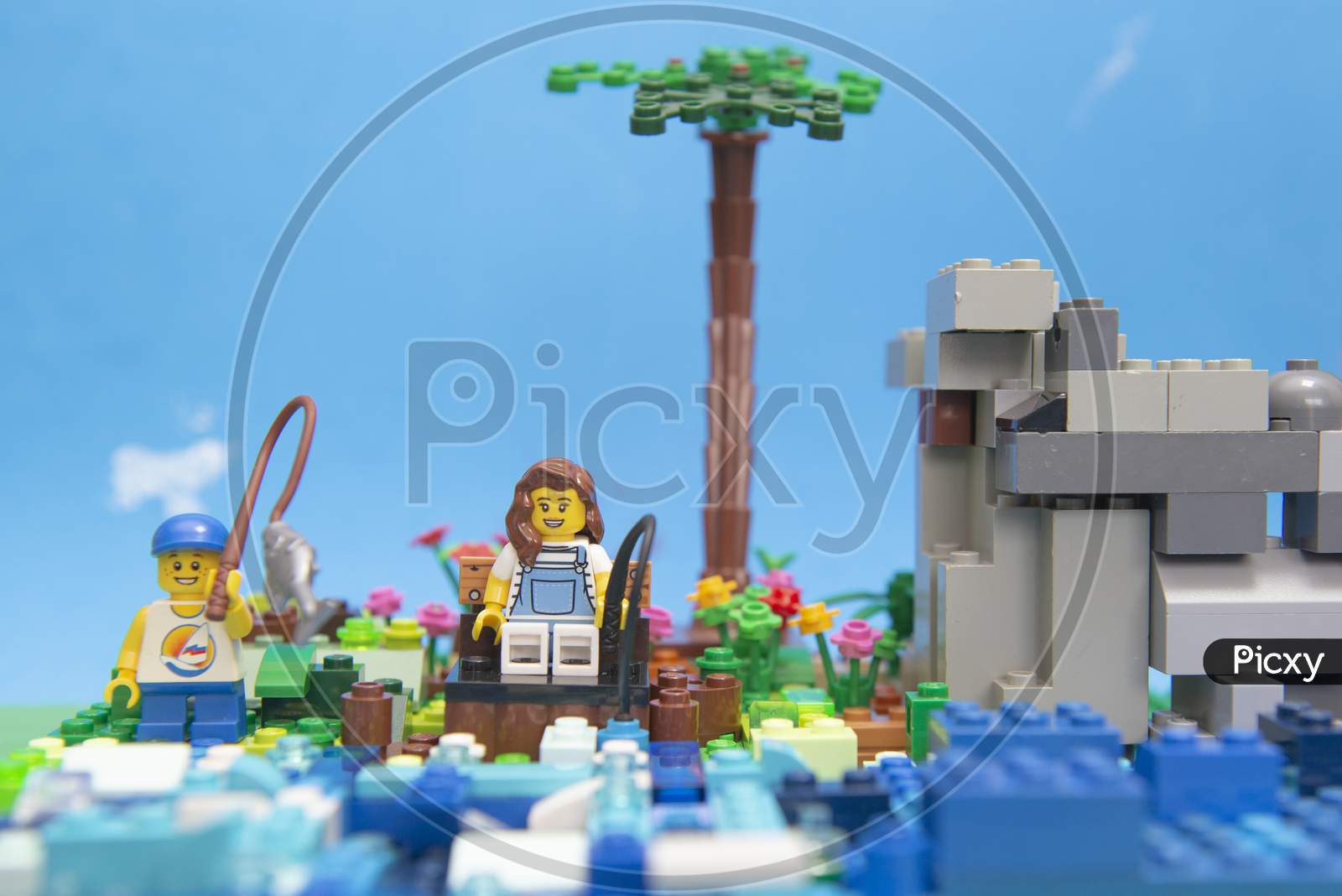 Florianopolis, Brazil. September 20, 2020: Minifigure Of Boy Fishing In Lake Next To His Mother. Concept Of Family Moment Without Technology, Increasingly Rare. Selective Foocus. Copy Space.
