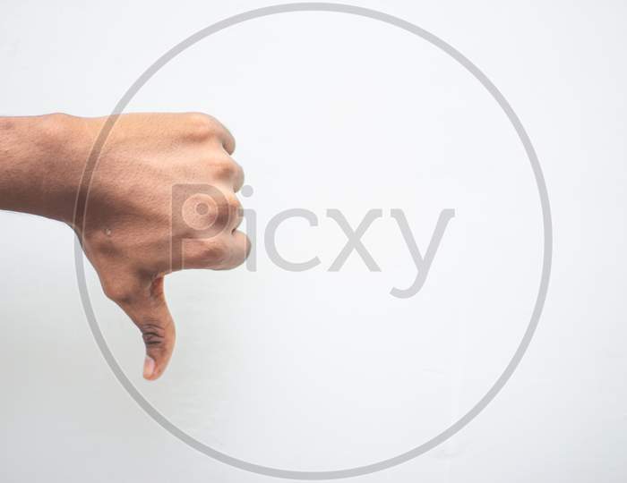 Unlike, Dislike, Failure Gestures Concept - Male Hand Showing Dislike Thumb Down Sign Isolated On White Background. Hand Symbol Sign Language.