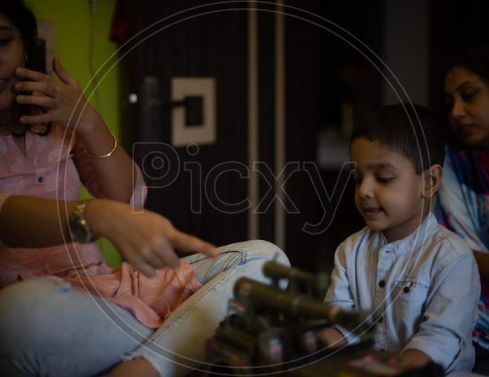 Indian boy child is playing with his mother
