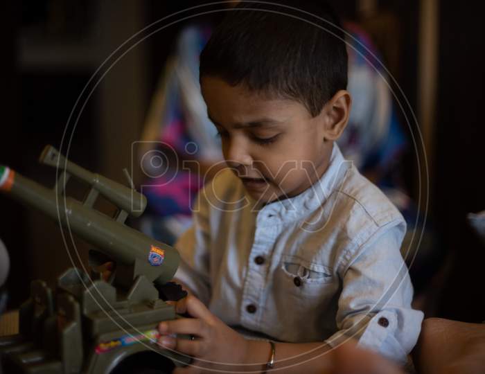 Indian boy child is playing with his mother