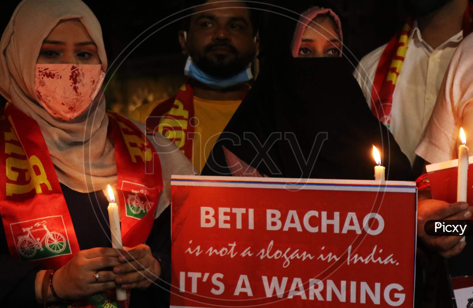 Women hold placards during a protest after the death of a rape victim, on a street in Mumbai, India, September 30, 2020.