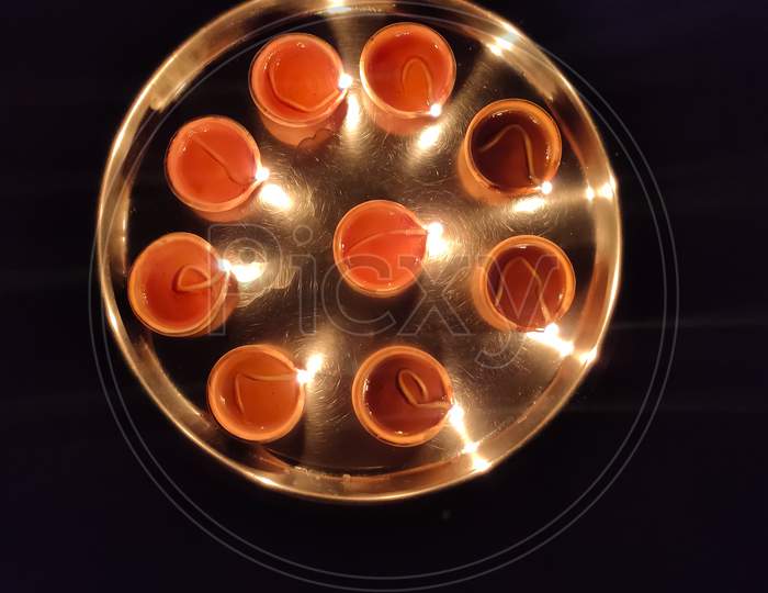A Clay Diya Also Called As Traditional Oil Lamps On Dark Background, Top View