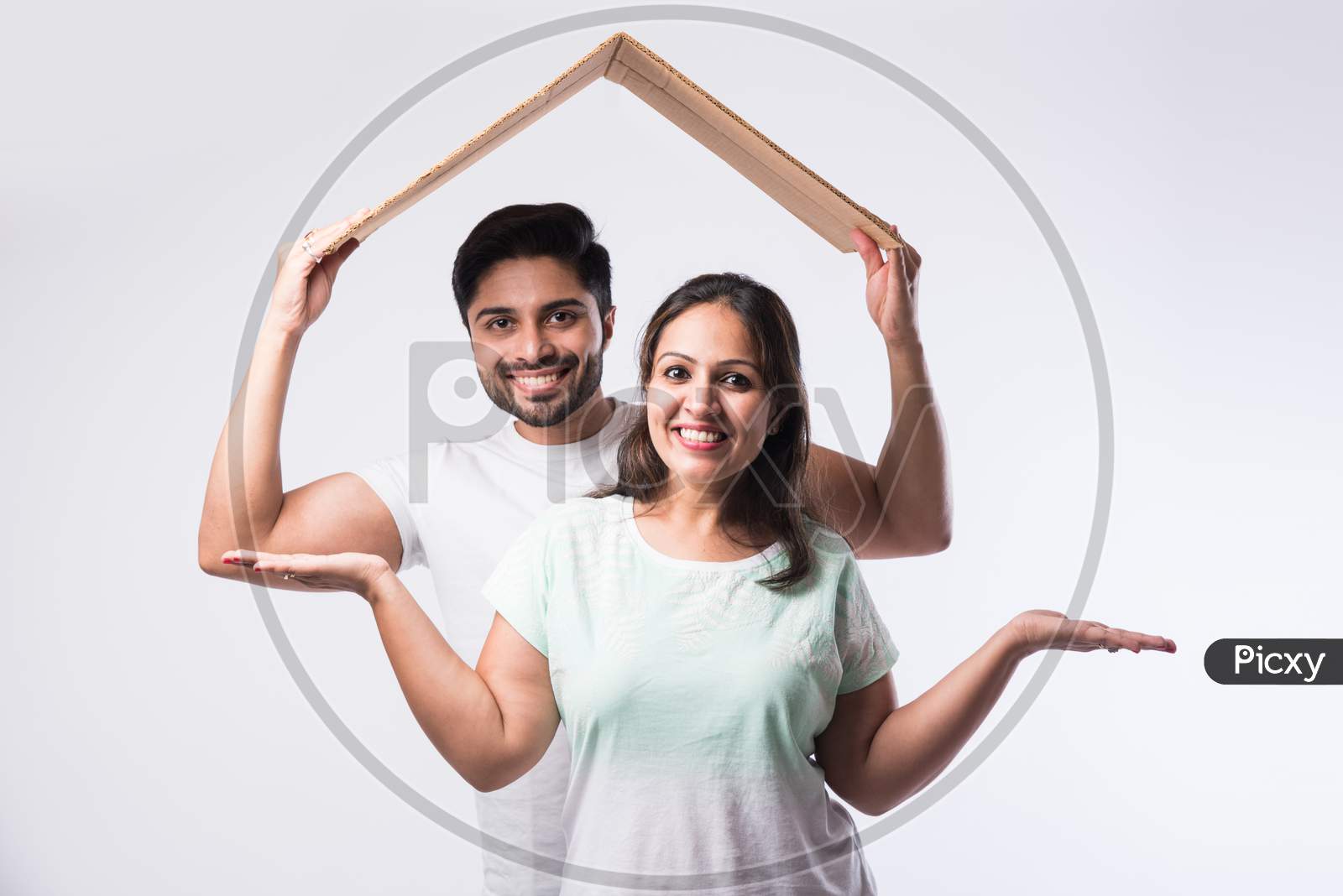 Concept Real Estate Housing And Young Indian Couple Family - Husband Wife Holding 3D Paper Model