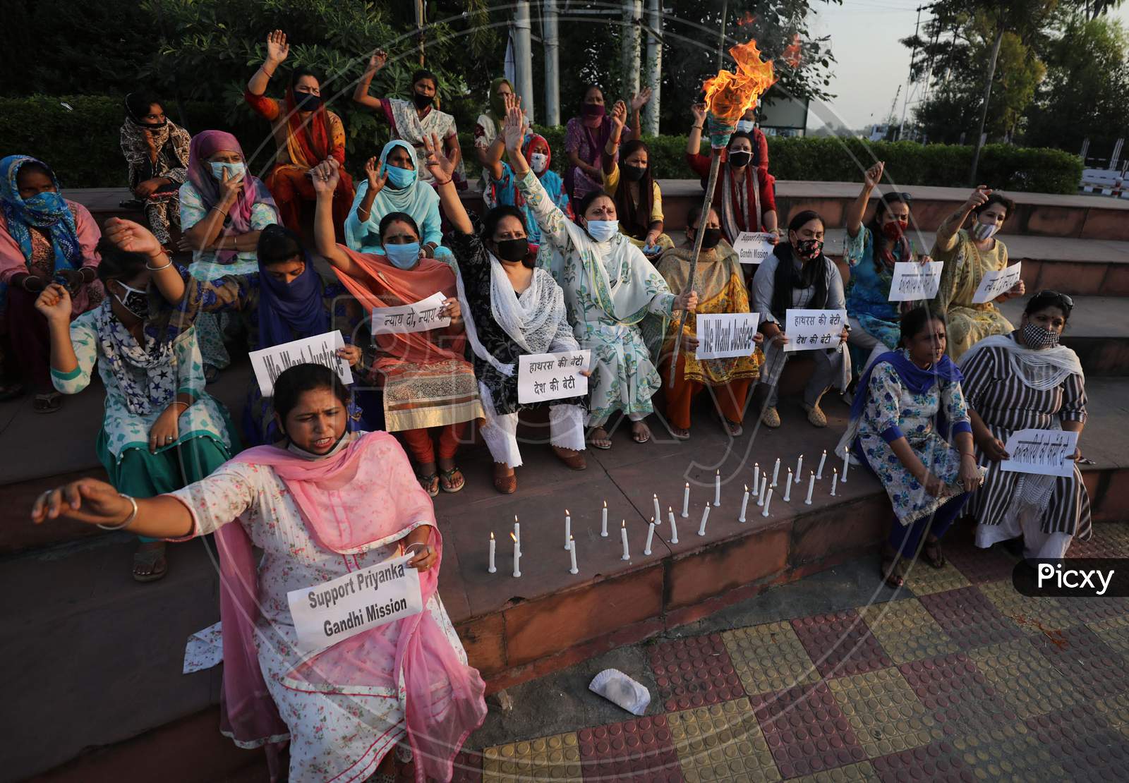 Mahila Congress light candles  and  raise slogans during a protest against the death of a 19-year-old Dalit woman in Jammu ,1 october,2020.