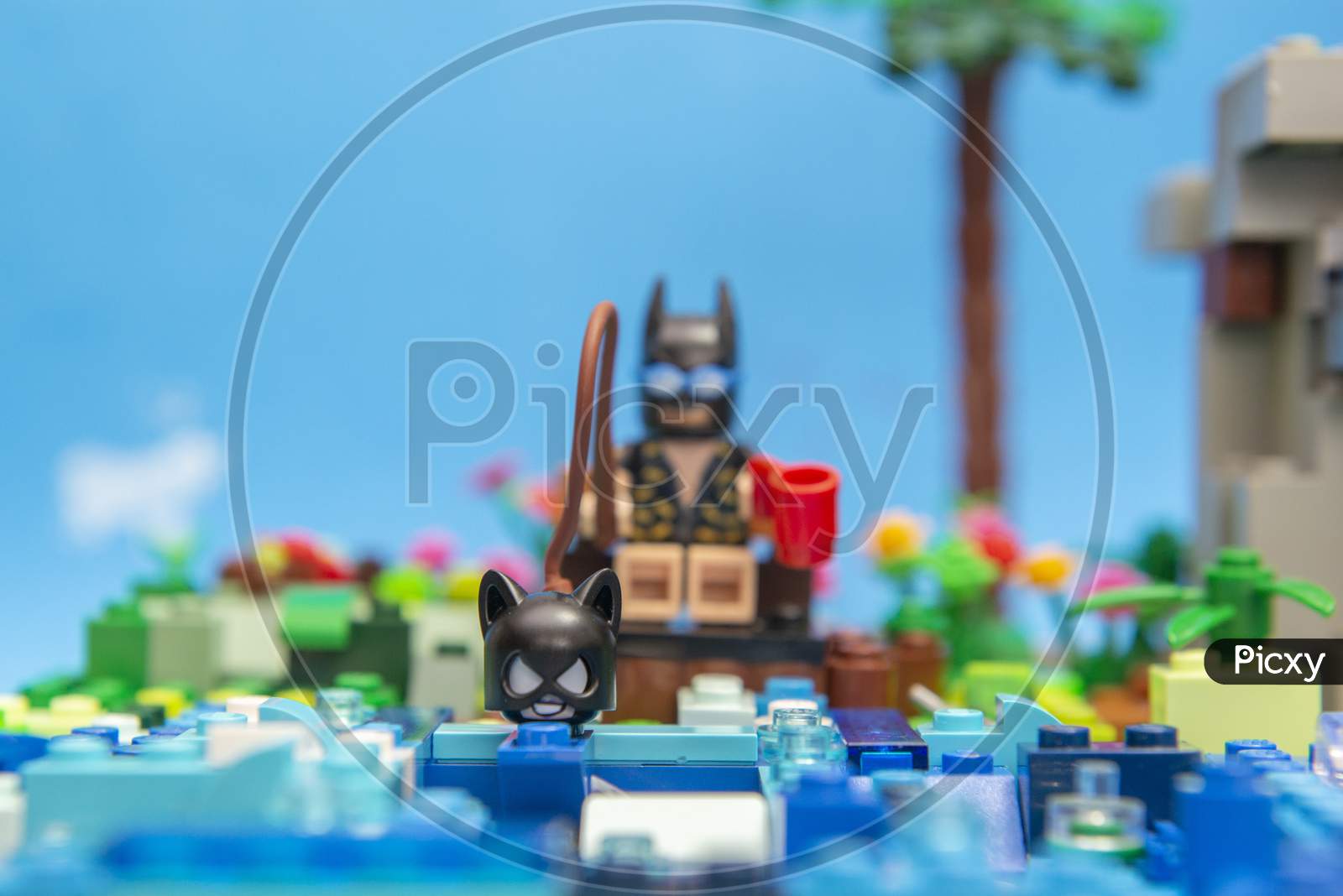 Florianopolis, Brazil. September 20, 2020: Batman Minifigure Fishing Catwoman In Lake. Concept Of Fishing Love. Super Heroes Love It Too. Selective Focus.