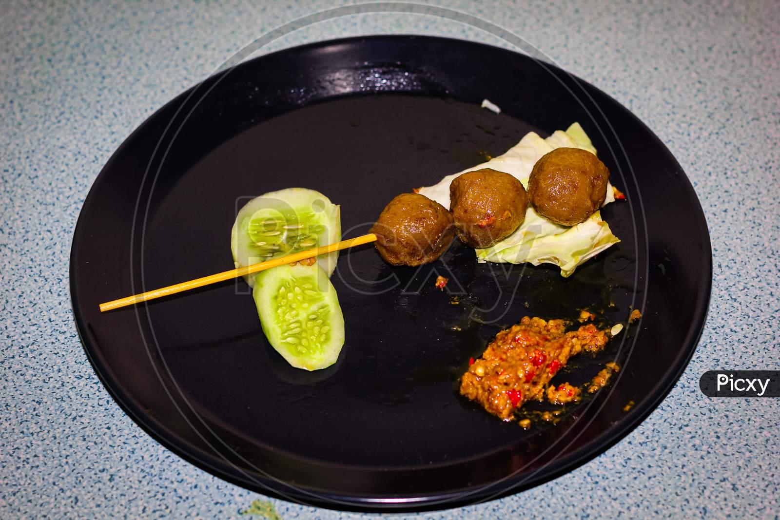 fried meatball (sate bakso) with vegetables
