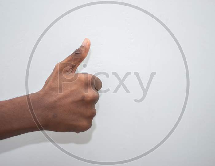 Thumbs Up Sign - Male Hand Showing Thumbs Up Sign Isolated On White Background. Hand Symbol Sign Language.
